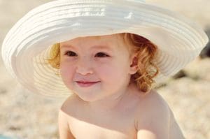 Always have baby wear a had to shade her face in addition to sunscreen in babies over 6 months